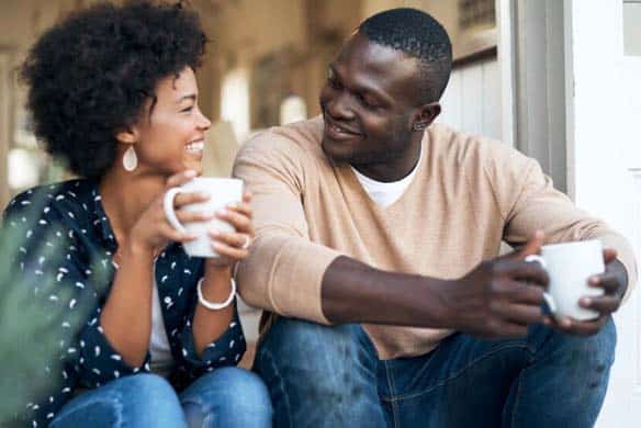 couple talking and drinking coffee