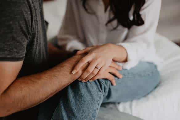 iStock-1036336154-fdh two people holding hands